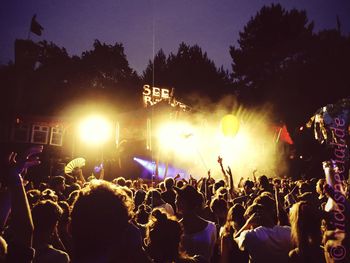 People enjoying music concert