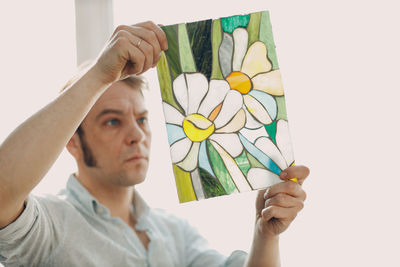 Artist looking at glazier