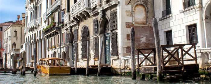 Waterfront palace with pier and boat in venice