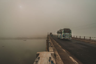 Bus on bridge against sky