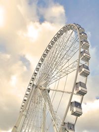 Low angle view of ferris wheel against sky