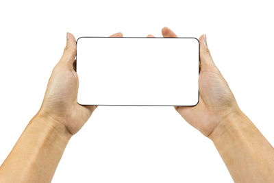 Low angle view of person using mobile phone against white background