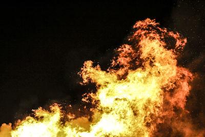 Low angle view of bonfire against sky at night