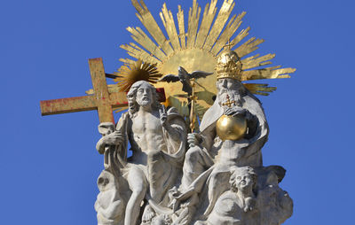 Low angle view of built structure against clear blue sky