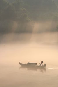 Silhouette of boat on water