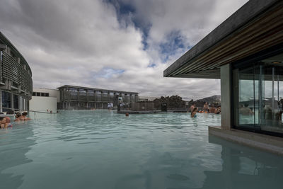 Reflection of buildings in swimming pool