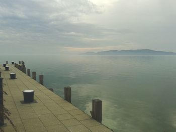 Scenic view of sea against cloudy sky