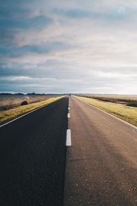 Empty road against sky