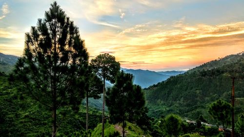 Scenic view of landscape against sky at sunset