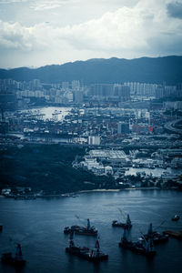 High angle view of sea and buildings in city