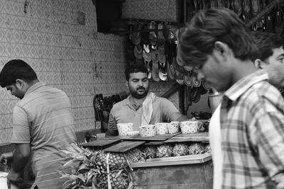 Men sitting in kitchen