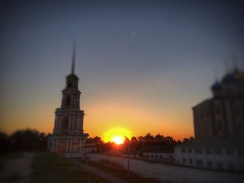 View of buildings against sky at sunset