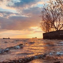 Scenic view of sea against sky during sunset