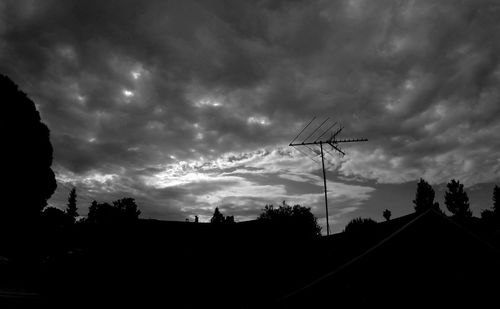Low angle view of building against cloudy sky