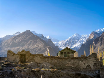 Scenic view of mountains against clear blue sky