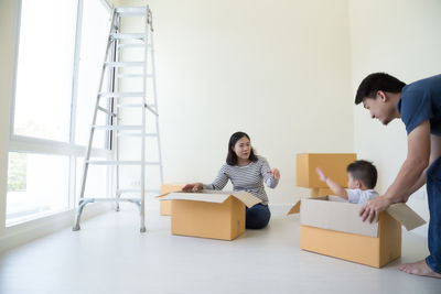 Young couple sitting in box