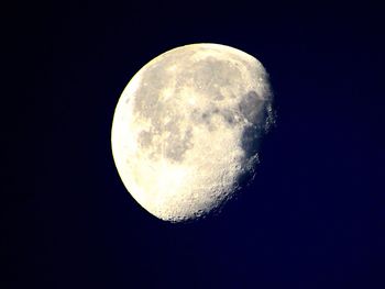 Low angle view of moon against clear sky at night