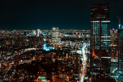 Illuminated buildings in city at night