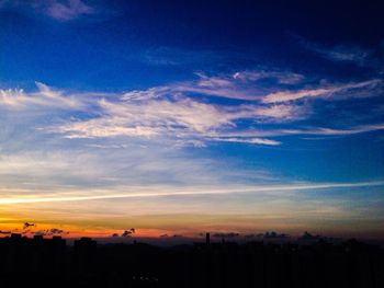 Scenic view of dramatic sky at sunset