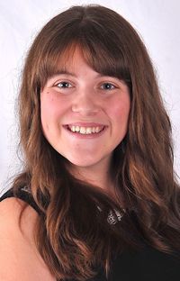 Portrait of smiling young woman against white background