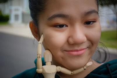 Close-up portrait of a smiling young woman