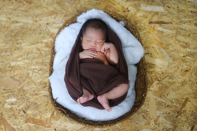 High angle view of baby girl sleeping