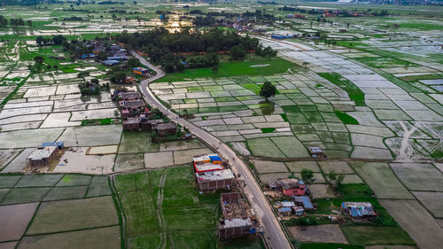 High angle view of people on street amidst buildings in city