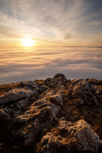 Scenic view of rock formation against sky during sunset