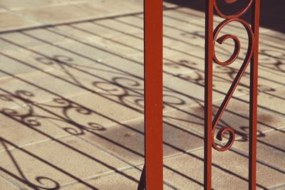 Metallic fence shadow silhouette in the street