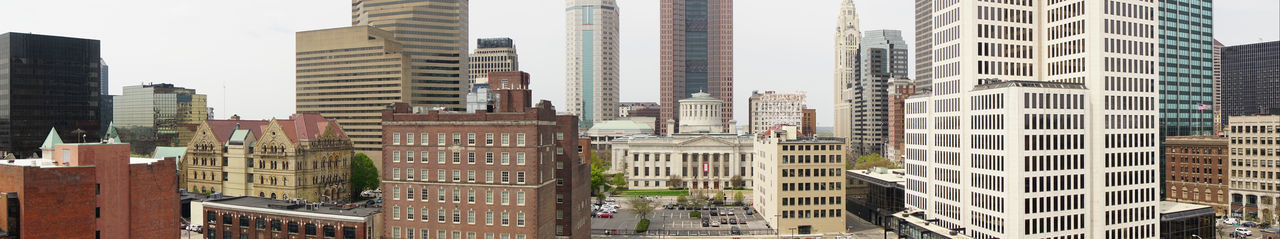 Buildings in city against sky