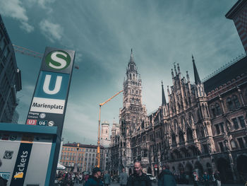 View of buildings against cloudy sky