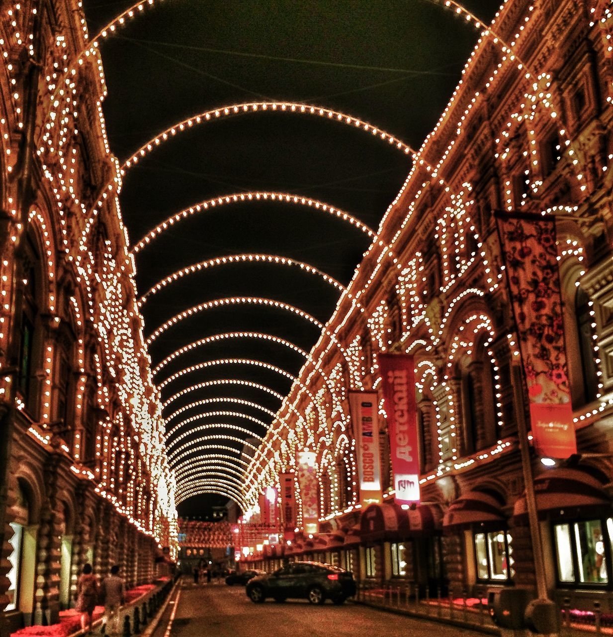 architecture, built structure, illuminated, indoors, ceiling, arch, lighting equipment, diminishing perspective, the way forward, incidental people, night, travel destinations, transportation, travel, low angle view, famous place, architectural feature, in a row, architectural column, vanishing point