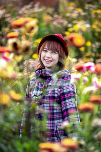 Portrait of smiling girl standing outdoors