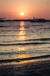 Scenic view of sea against romantic sky at sunset