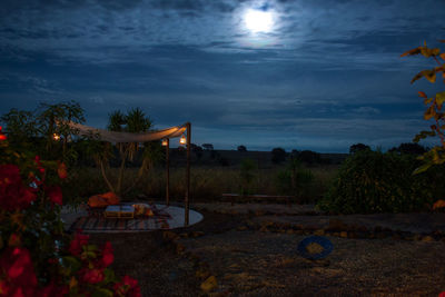 Scenic view of beach against sky at night