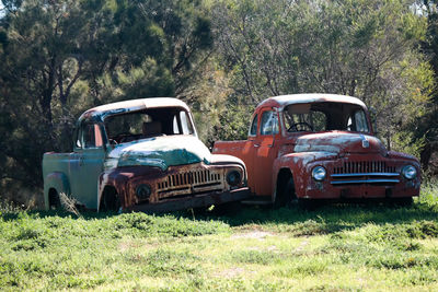 Abandoned car on field