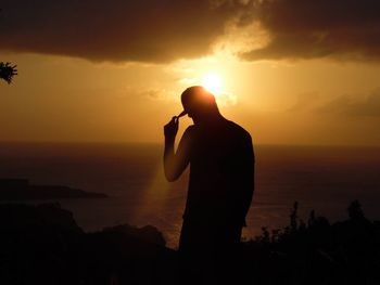 Scenic view of sea at sunset