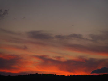 Low angle view of dramatic sky during sunset