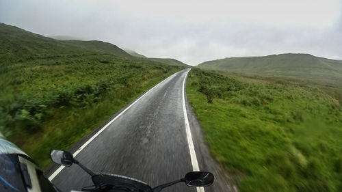 Road passing through field