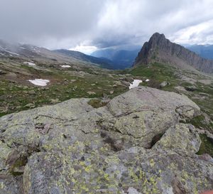 Scenic view of mountains against cloudy sky