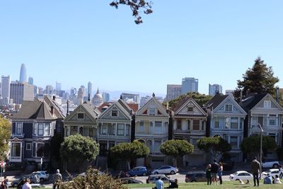 Buildings in city against clear sky