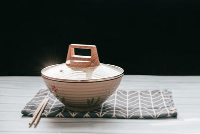 Close-up of container on table