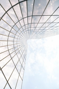 Low angle view of skyscraper against cloudy sky