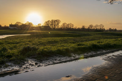 Scenic view of landscape against sky during sunset