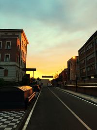 View of city street at sunset