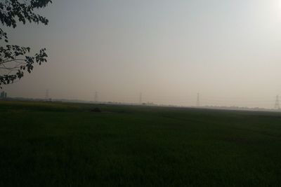 Scenic view of field against sky during sunset