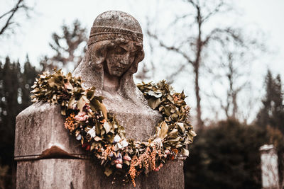 Low angle view of statue against trees