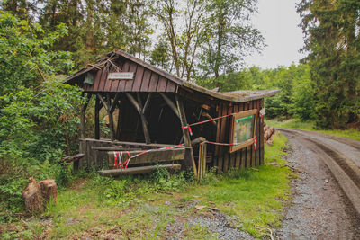 View of abandoned car on field