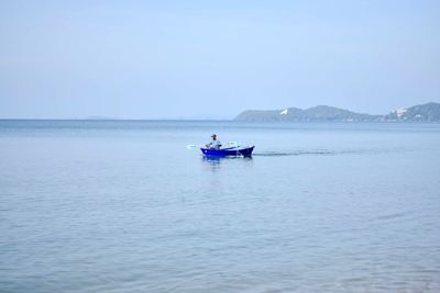 Boat in sea against clear sky