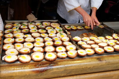 Man preparing food at market stall